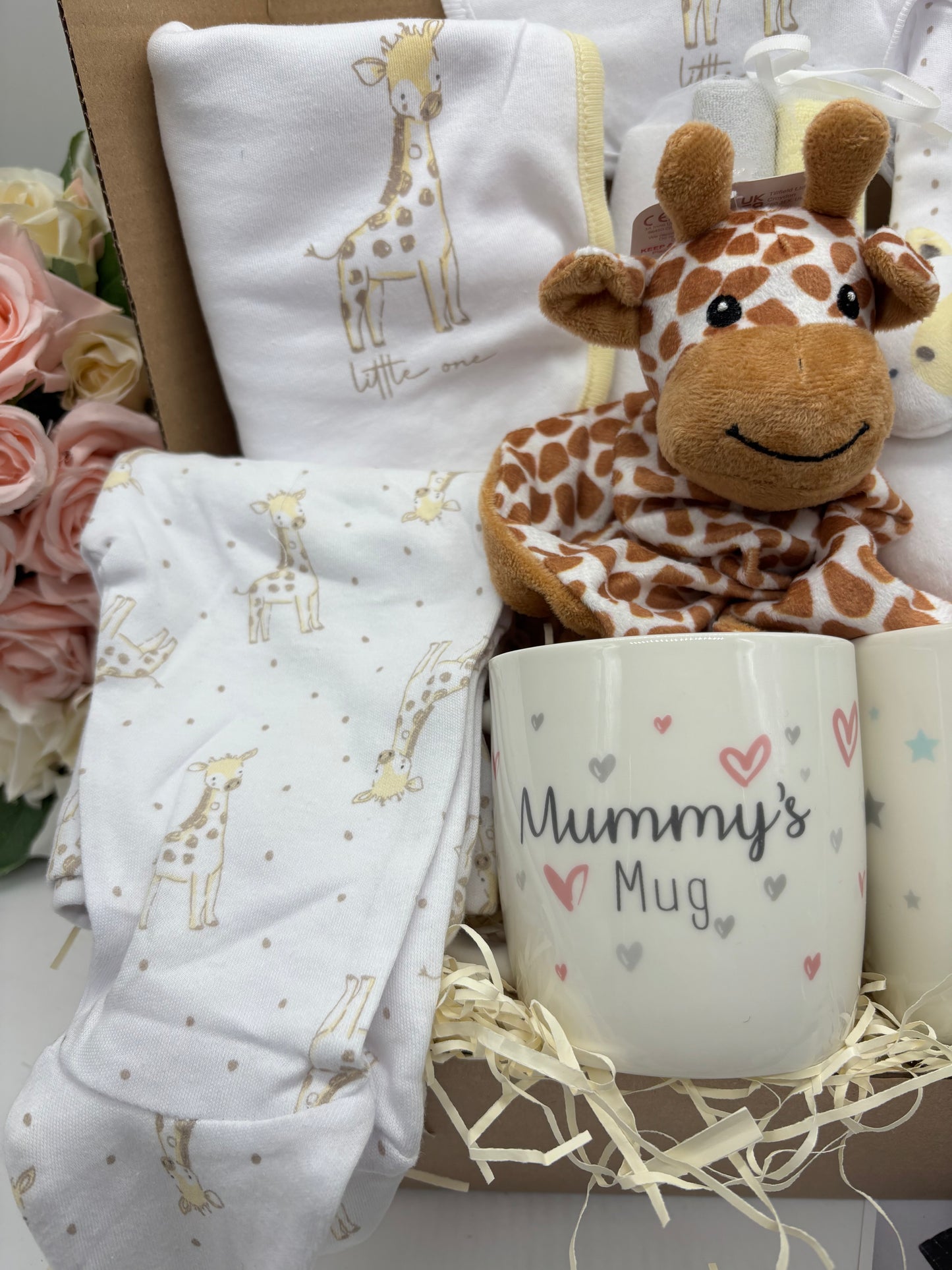 Giraffe comforter with giraffe sleepsuit and Mummy's Mug in the new baby gift box