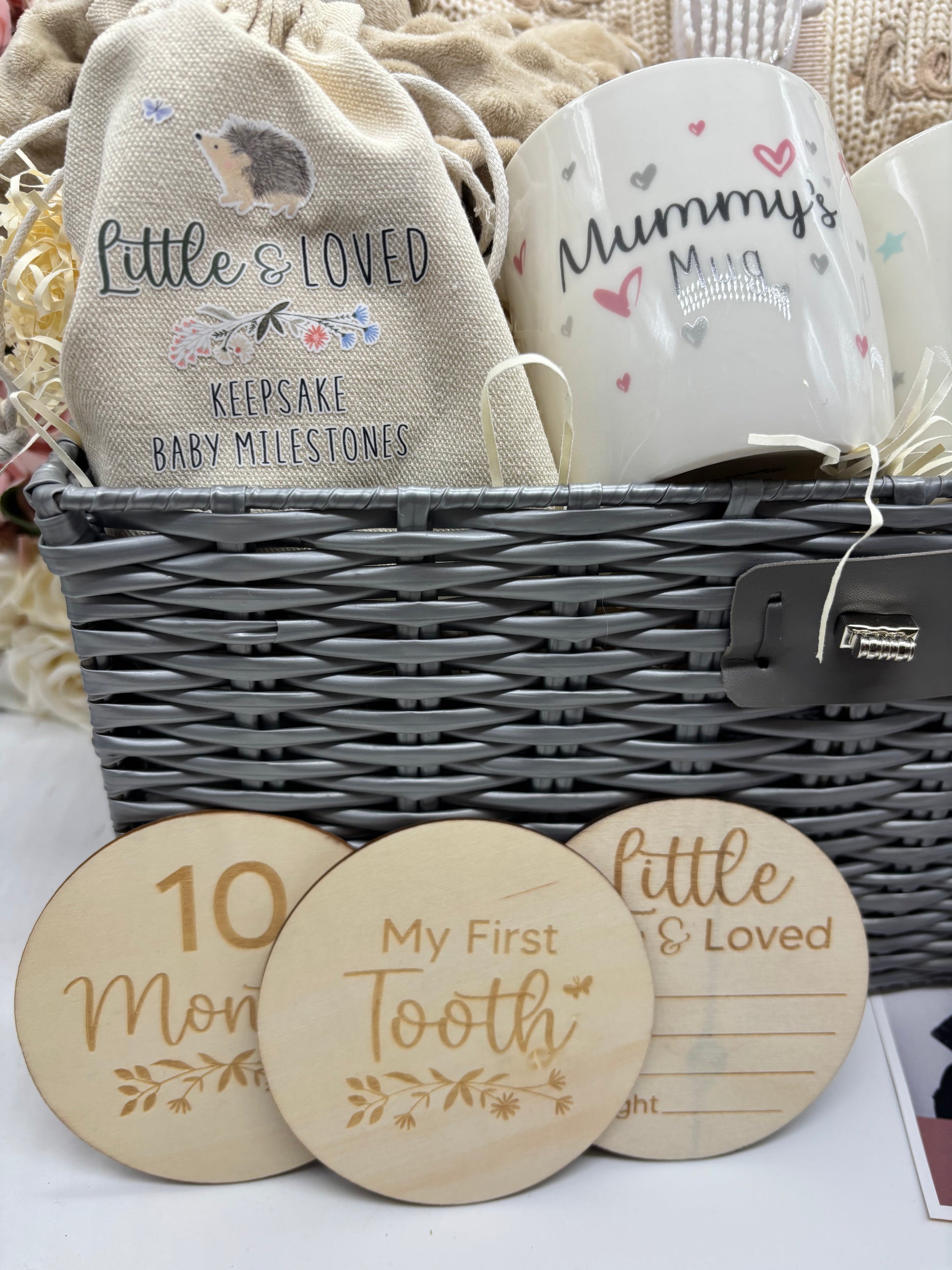 Keepsake milestone pouch, Mummy's Mug and My First Tooth milestone discs in the neutral hamper