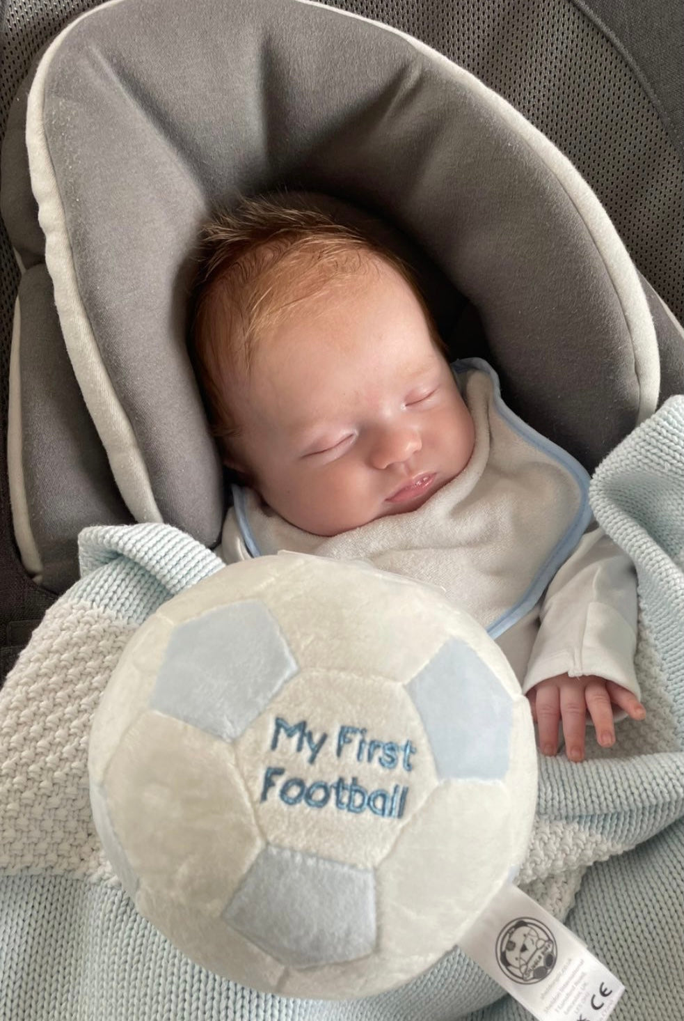 Football-themed newborn baby rattle gift